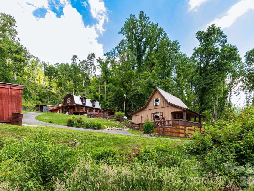 1010 and 1014 Melton Branch Road, Bakersville, NC 28705.  MLS# CAR4333369, YatesRealty ID 25045. Front View of 2 homes