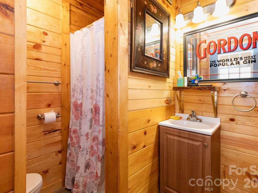 1010 and 1014 Melton Branch Road, Bakersville, NC 28705.  MLS# CAR4333369, YatesRealty ID 25045. Main Level Bathroom