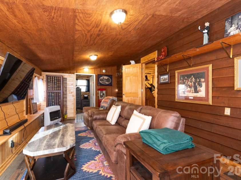 1010 and 1014 Melton Branch Road, Bakersville, NC 28705.  MLS# CAR4333369, YatesRealty ID 25045. Main Level Family/Living Room