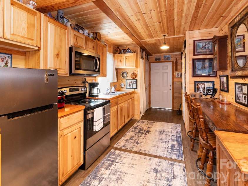1010 and 1014 Melton Branch Road, Bakersville, NC 28705.  MLS# CAR4333369, YatesRealty ID 25045. Main Level Kitchen