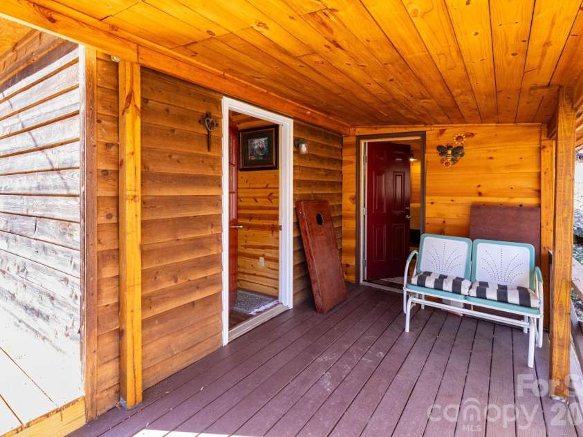 1010 and 1014 Melton Branch Road, Bakersville, NC 28705.  MLS# CAR4333369, YatesRealty ID 25045. Main Level Side Porch - with access to 3rd sleeping room