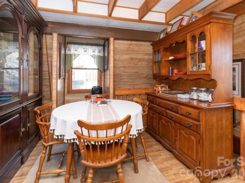 1010 and 1014 Melton Branch Road, Bakersville, NC 28705.  MLS# CAR4333369, YatesRealty ID 25045. Upstairs Dining Area