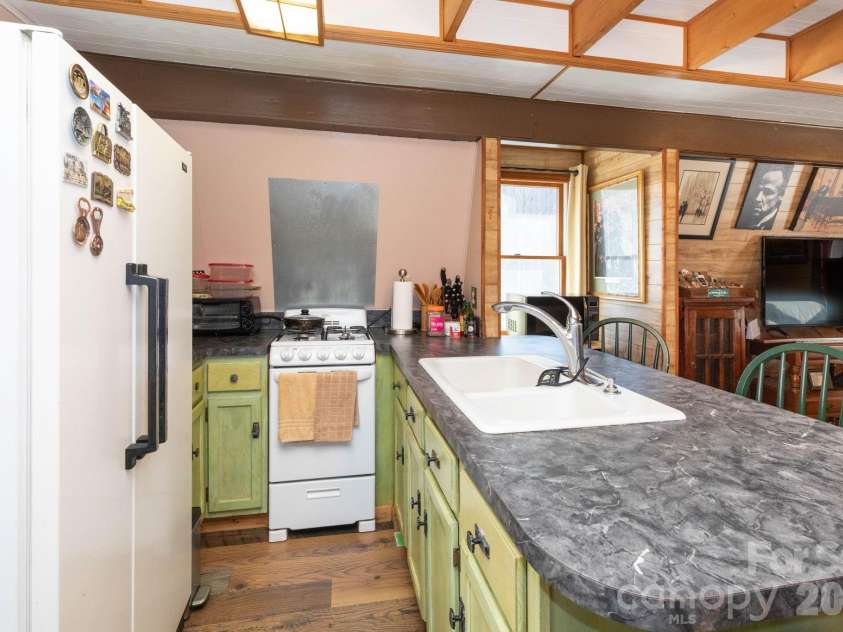 1010 and 1014 Melton Branch Road, Bakersville, NC 28705.  MLS# CAR4333369, YatesRealty ID 25045. Upstairs Kitchen