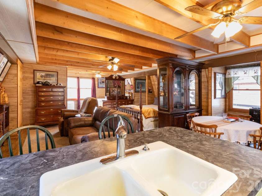 1010 and 1014 Melton Branch Road, Bakersville, NC 28705.  MLS# CAR4333369, YatesRealty ID 25045. Upstairs Kitchen/Living/Sleeping Area