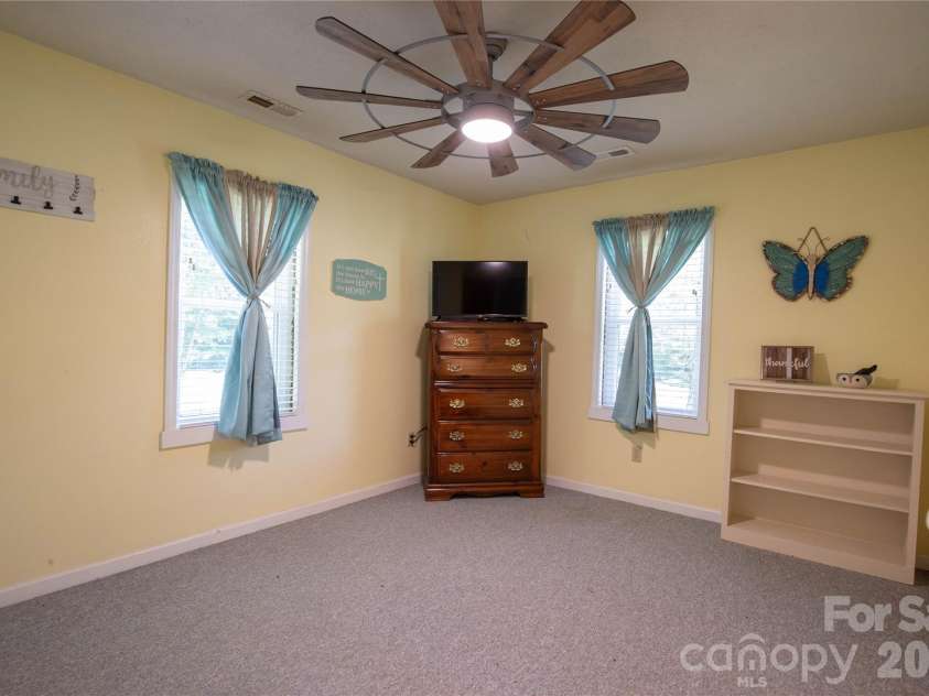 84 Sheets Farm Road, Bakersville, NC 28705.  MLS# CAR4384687, YatesRealty ID 25058. Down Stairs Bedroom