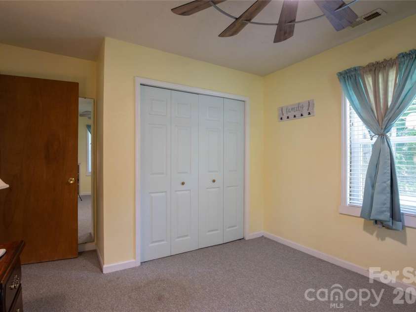 84 Sheets Farm Road, Bakersville, NC 28705.  MLS# CAR4384687, YatesRealty ID 25058. Down Stairs Bedroom