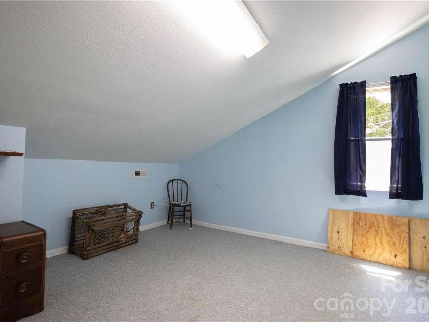 84 Sheets Farm Road, Bakersville, NC 28705.  MLS# CAR4384687, YatesRealty ID 25058. Upstairs Bedroom
