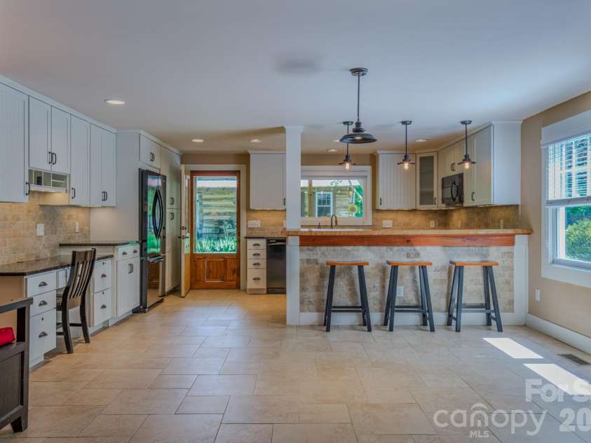 75 Old Gap Creek Road, Fairview, NC 28730.  MLS# CAR4378192, YatesRealty ID 25066. View from den toward kitchen