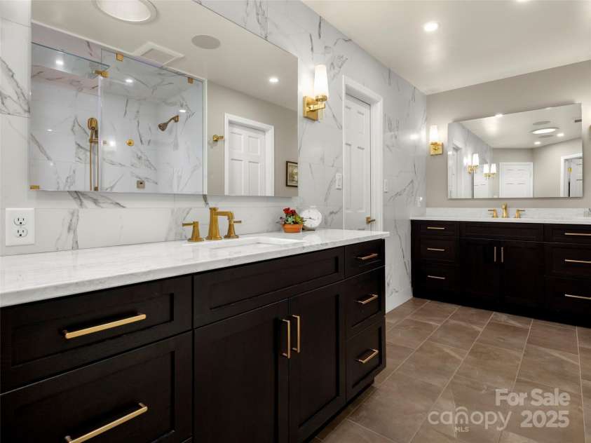 3301 Timber Trail, Asheville, NC 28804.  MLS# CAR4270898, YatesRealty ID 25068. Completely updated spacious and modern en-suite bathroom with two vanities and a plethora of storage.