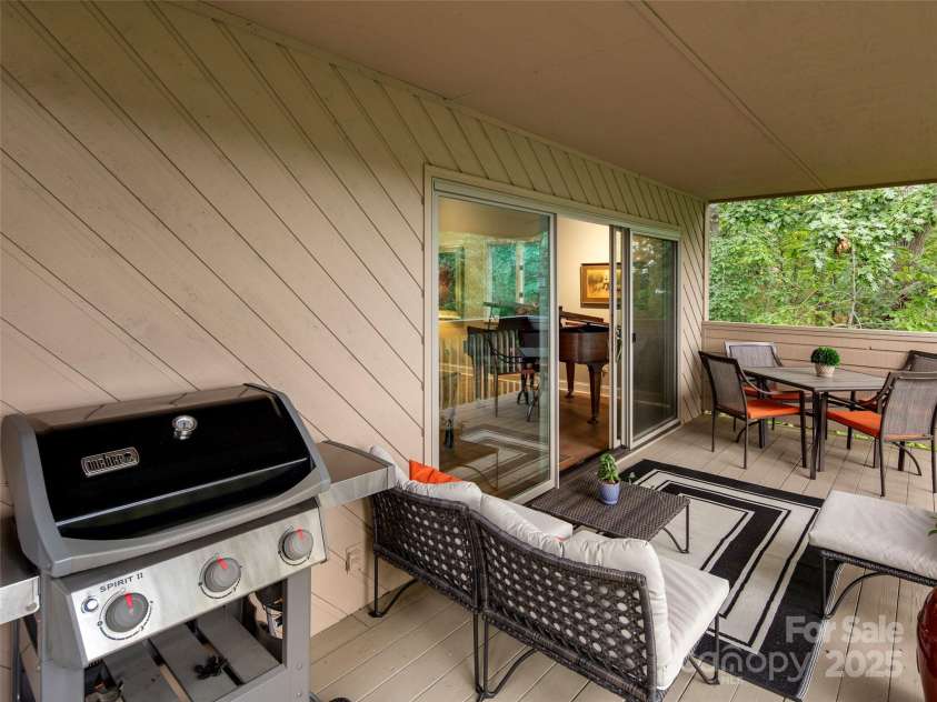 3301 Timber Trail, Asheville, NC 28804.  MLS# CAR4270898, YatesRealty ID 25068. Spacious covered rear deck.
