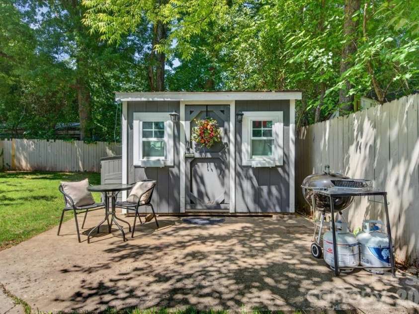 904 Academy Street, Charlotte, NC 28205.  MLS# CAR4380791, YatesRealty ID 25069. Spacious shed in the back yard painted to match the home, with a concrete pad perfect for gathering
