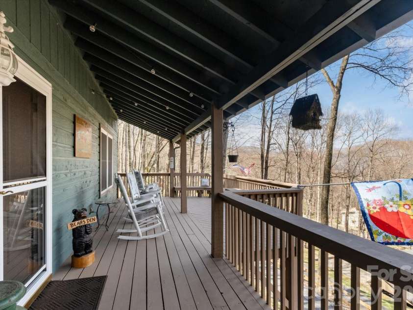 46 Hummingbird Drive, Maggie Valley, NC 28751.  MLS# CAR4356639, YatesRealty ID 25070. Front Porch Spring View