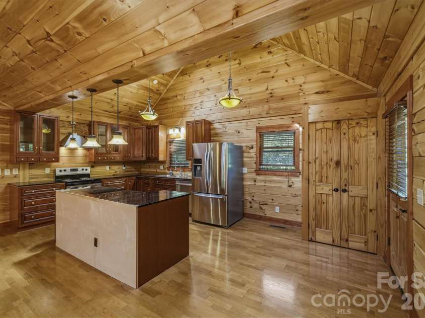 732 Grandview Peaks Drive, Nebo, NC 28761.  MLS# CAR4379354, YatesRealty ID 25071. Great Room, Dining Area & Kitchen