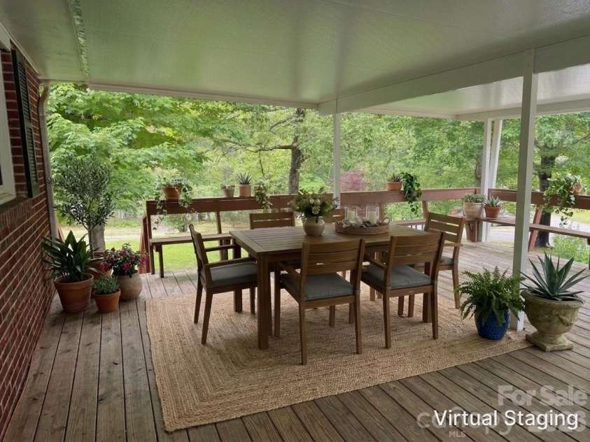 44 Tuttle Road, Hendersonville, NC 28792.  MLS# CAR4359823, YatesRealty ID 25084. Envision what your covered patio could look like.