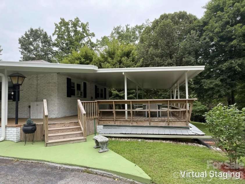 44 Tuttle Road, Hendersonville, NC 28792.  MLS# CAR4359823, YatesRealty ID 25084. Imagine a fresh look with paint and deck stain color (virtually staged)