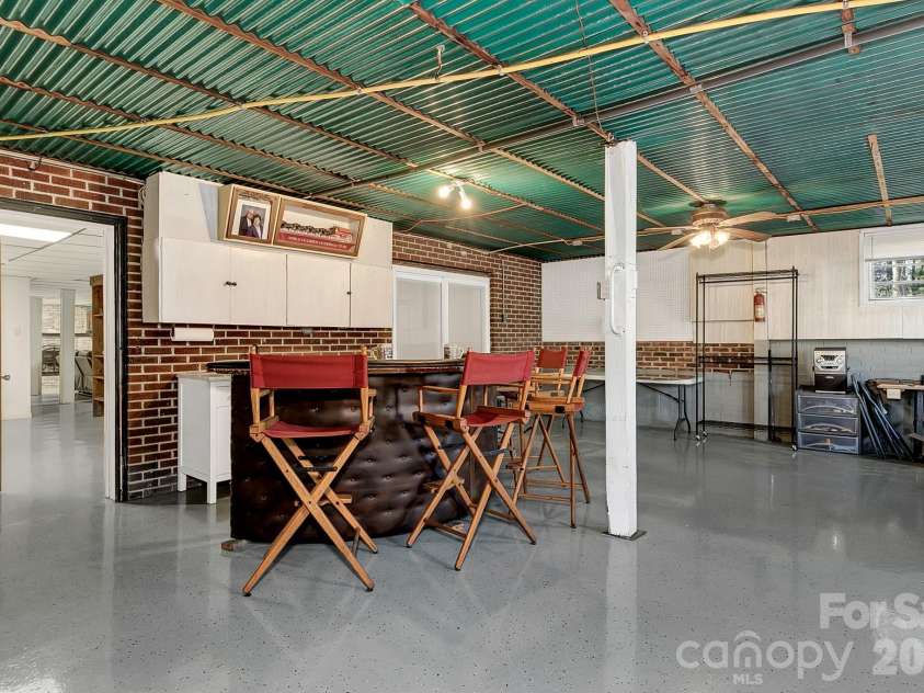 44 Tuttle Road, Hendersonville, NC 28792.  MLS# CAR4359823, YatesRealty ID 25084. Lower level workshop space.