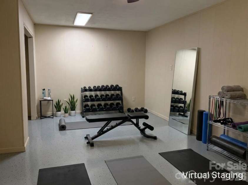 44 Tuttle Road, Hendersonville, NC 28792.  MLS# CAR4359823, YatesRealty ID 25084. Perhaps the extra space becomes a workout room?