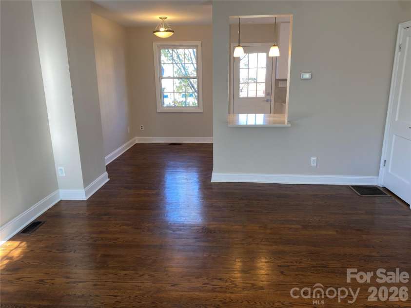 524 Wakefield Drive, Charlotte, NC 28209.  MLS# CAR4329255, YatesRealty ID 25088. Den opens to dining area.