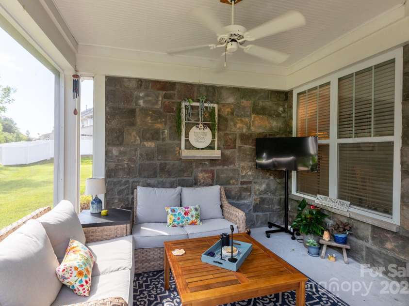 9826 Springholm Drive, Charlotte, NC 28278.  MLS# CAR4277978, YatesRealty ID 25105. Fully screened in porch for morning coffee!