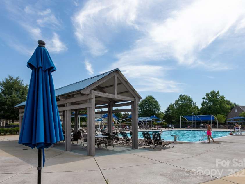 9826 Springholm Drive, Charlotte, NC 28278.  MLS# CAR4277978, YatesRealty ID 25105. Pool Cabanas for shady relaxation