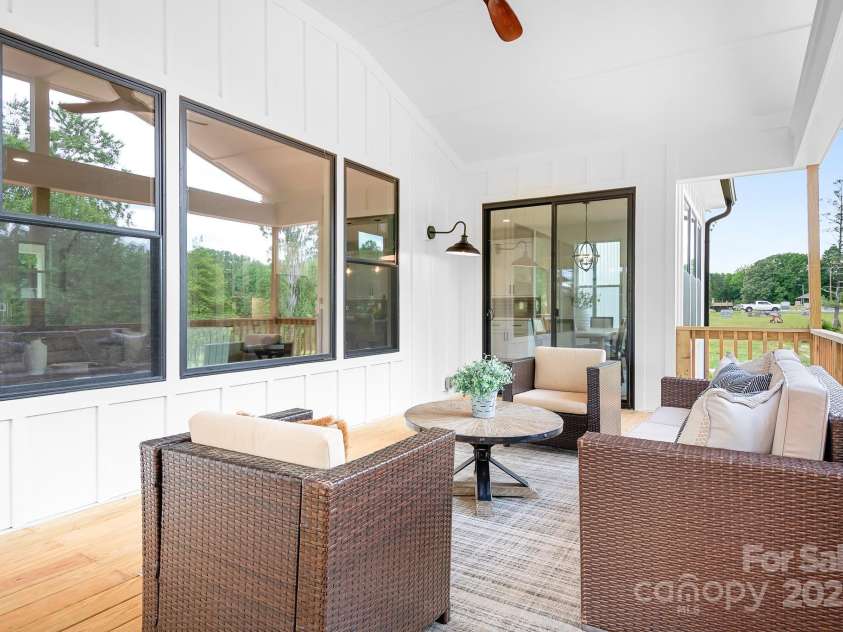 104 Arbor Drive, Waxhaw, NC 28173.  MLS# CAR4258251, YatesRealty ID 25109. Right off the main living space, this covered porch extends your home into the outdoors—comfort meets fresh air.