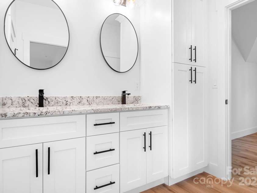 104 Arbor Drive, Waxhaw, NC 28173.  MLS# CAR4258251, YatesRealty ID 25109. With separate vanities and plenty of storage, this Jack and Jill bath is the perfect shared space that doesn’t feel like sharing at all.
