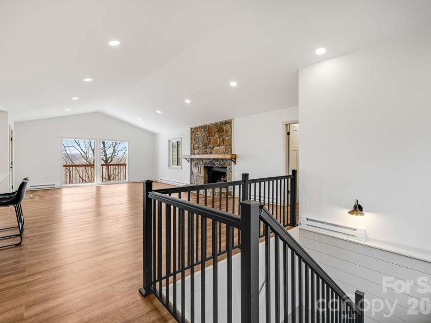 1065 Oak Ridge Lane, Mars Hill, NC 28754.  MLS# CAR4358606, YatesRealty ID 25115. Great Room and Steps to Lower Level