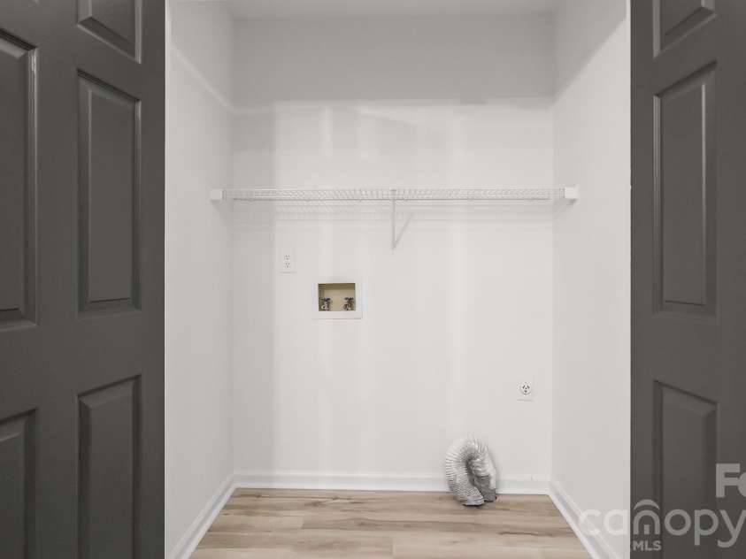 8815 Burnt Umber Drive, Charlotte, NC 28215.  MLS# CAR4384212, YatesRealty ID 25126. Convenient Laundry Closet on Main Level