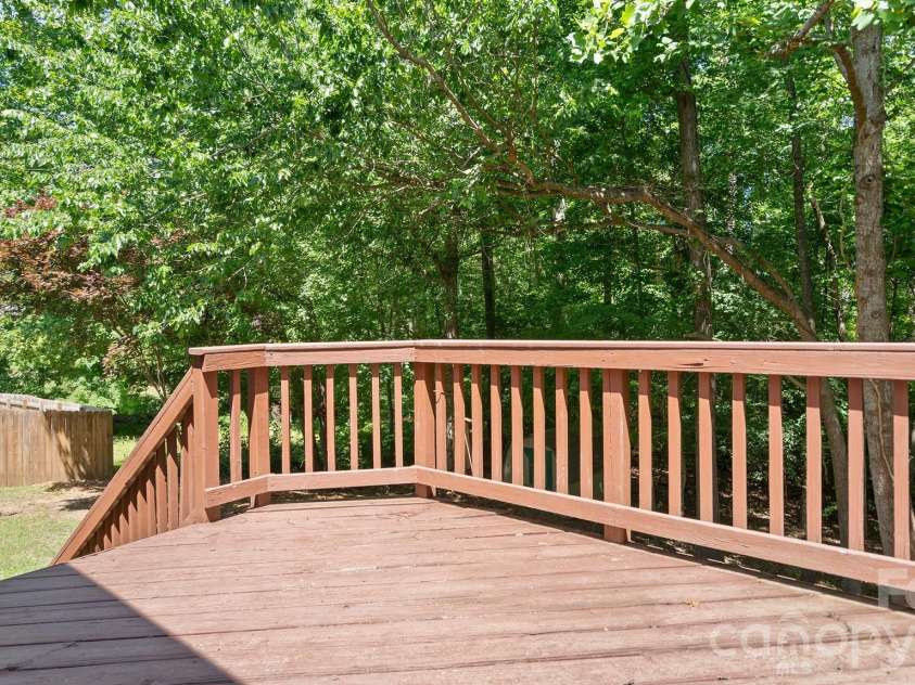 8815 Burnt Umber Drive, Charlotte, NC 28215.  MLS# CAR4384212, YatesRealty ID 25126. Relaxing Rear Deck with Access to Backyard