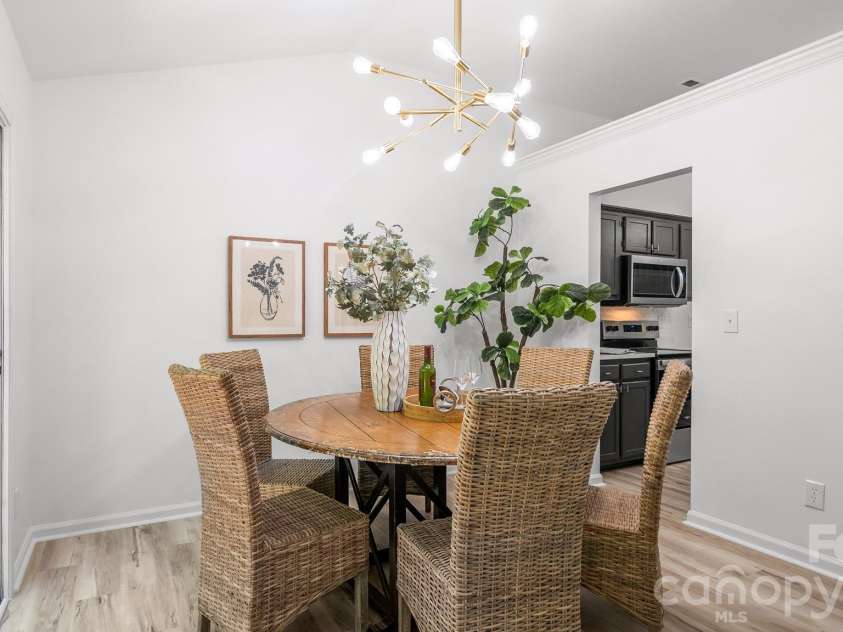 8815 Burnt Umber Drive, Charlotte, NC 28215.  MLS# CAR4384212, YatesRealty ID 25126. Spacious Sunlit Dining Area with Sliding Glass Doors
