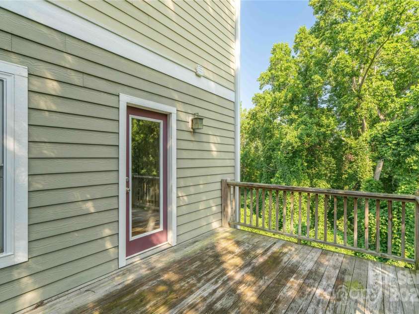 20 Cross Place, Asheville, NC 28801.  MLS# CAR4279844, YatesRealty ID 25137. Deck located just off the dining area
