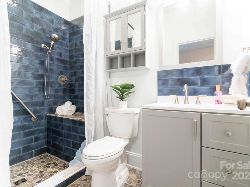 20 Cross Place, Asheville, NC 28801.  MLS# CAR4279844, YatesRealty ID 25137. Newly remodeled full bath in basement