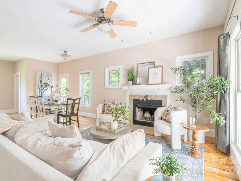 20 Cross Place, Asheville, NC 28801.  MLS# CAR4279844, YatesRealty ID 25137. The Living Room features a wood burning fireplace