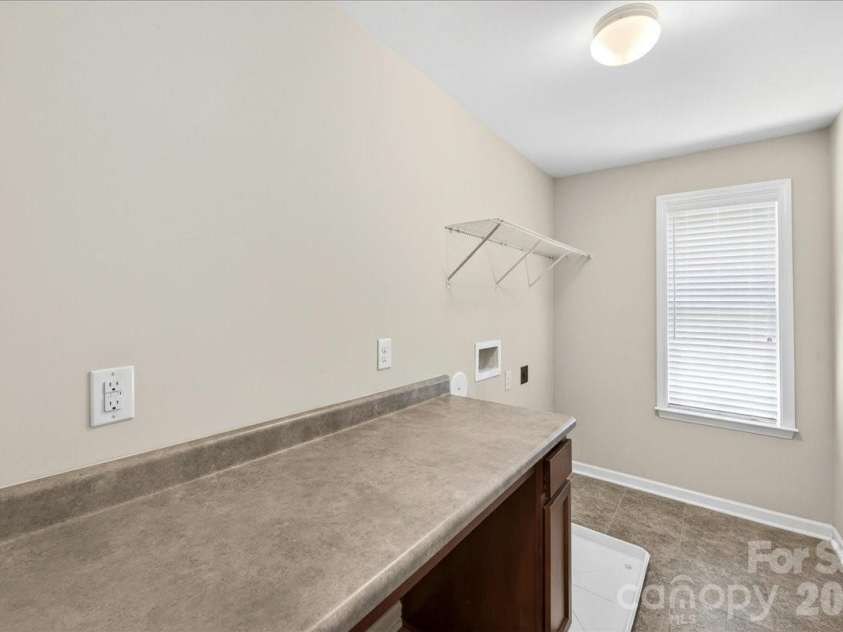 2053 Pine Siskin Court, Fort Mill, SC 29707.  MLS# CAR4381919, YatesRealty ID 25143. Laundry room