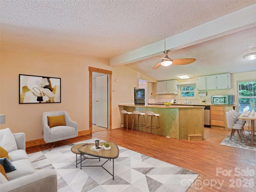 102 Serenity Lane, Clyde, NC 28721.  MLS# CAR4384211, YatesRealty ID 25163. Living Room Virtually Staged