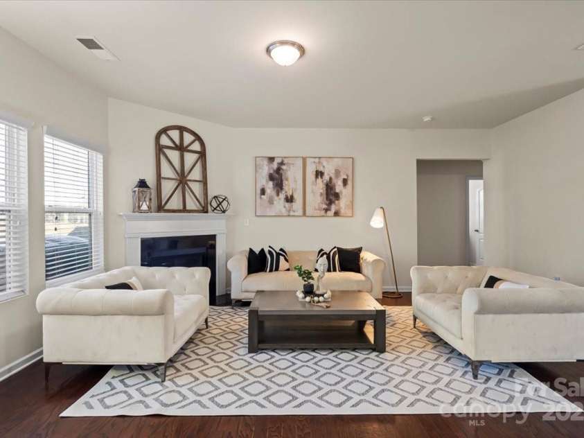 5703 Eleanor Rigby Road, Charlotte, NC 28278.  MLS# CAR4232389, YatesRealty ID 2517. Open living area with fireplace