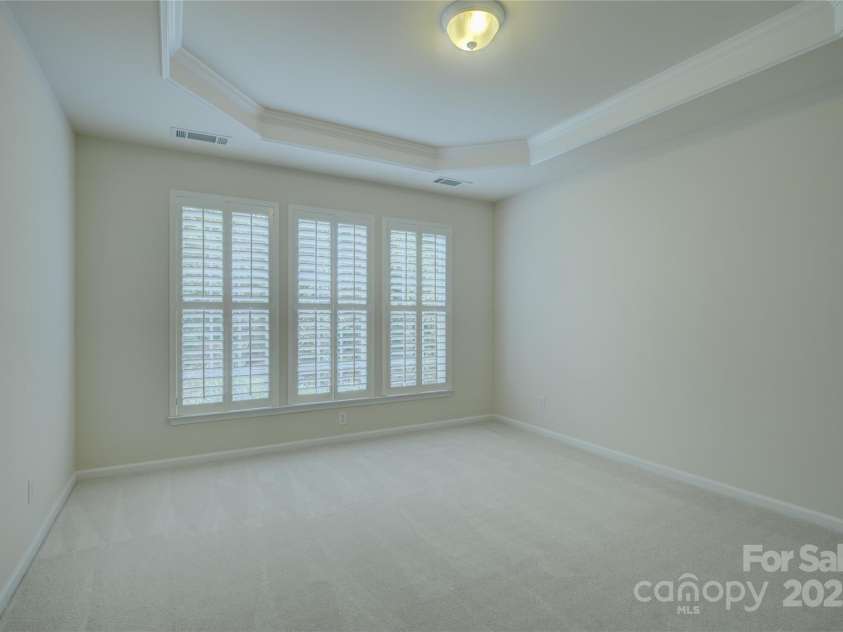 4004 Twiddy Street, Fort Mill, SC 29707.  MLS# CAR4279197, YatesRealty ID 25176. Primary Bedroom with tray ceiling.