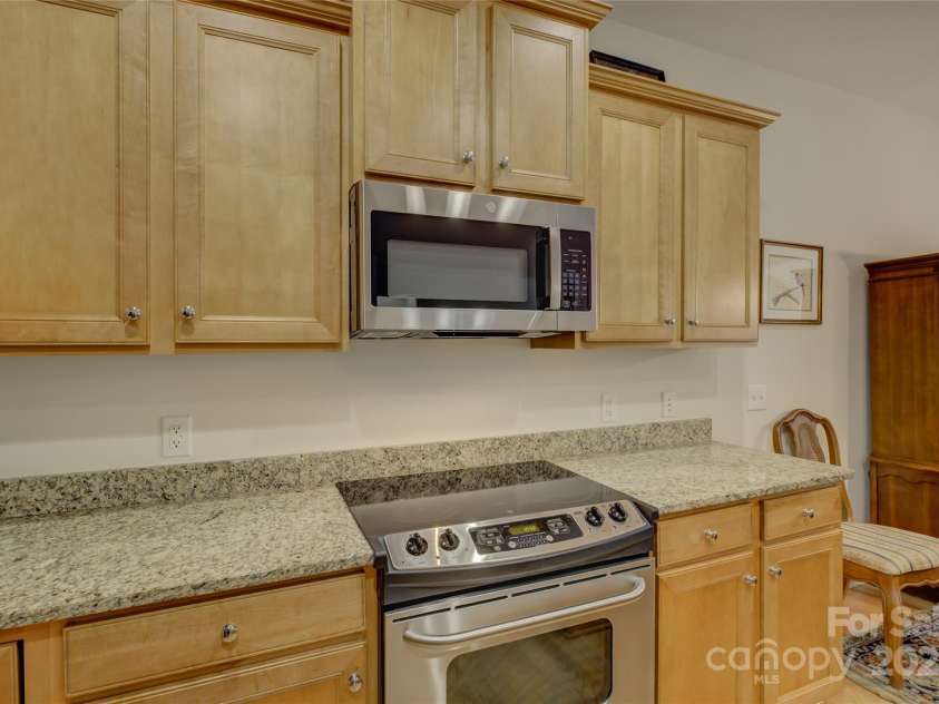 4004 Twiddy Street, Fort Mill, SC 29707.  MLS# CAR4279197, YatesRealty ID 25176. Smooth top range and microwave above.