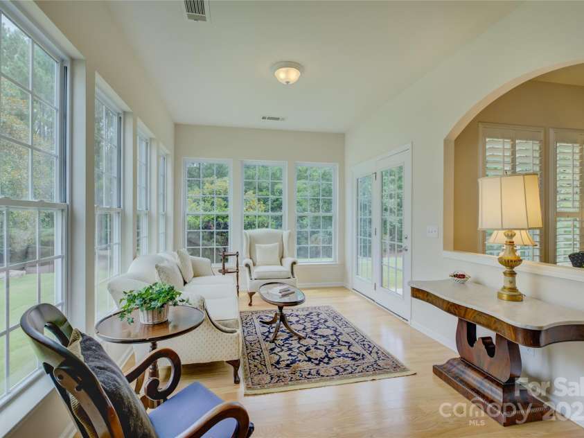 4004 Twiddy Street, Fort Mill, SC 29707.  MLS# CAR4279197, YatesRealty ID 25176. Sunroom with lots of windows and view of private backyard.