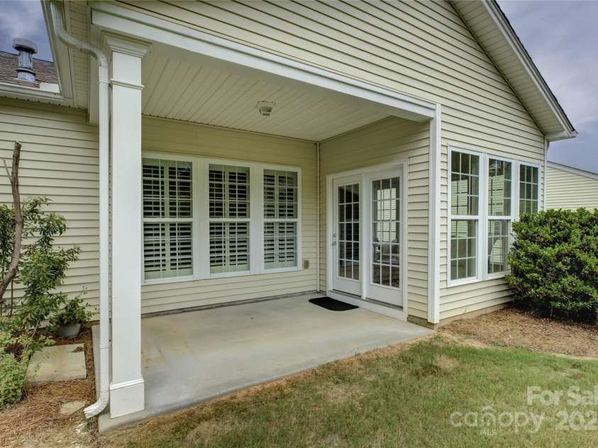 4004 Twiddy Street, Fort Mill, SC 29707.  MLS# CAR4279197, YatesRealty ID 25176. The covered back patio.