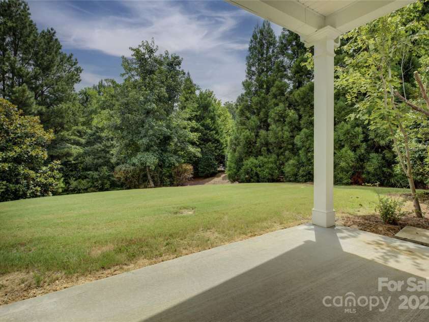 4004 Twiddy Street, Fort Mill, SC 29707.  MLS# CAR4279197, YatesRealty ID 25176. View of Backyard from the covered patio.