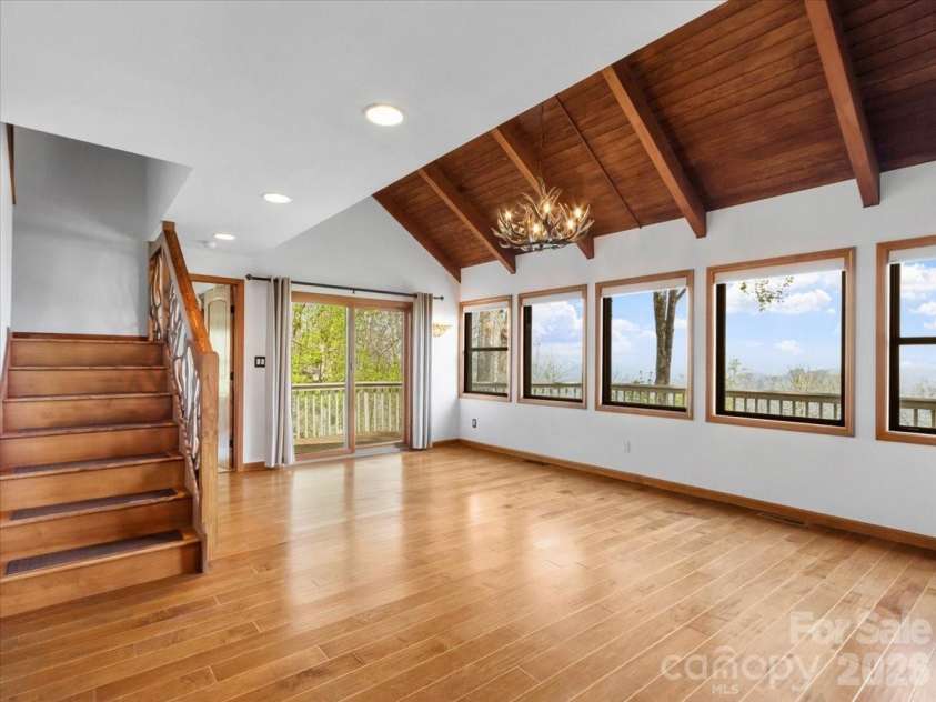 49 Slickrock Ridge Way, Burnsville, NC 28714.  MLS# CAR4367218, YatesRealty ID 25177. Vaulted ceiling with custom railing to upper level