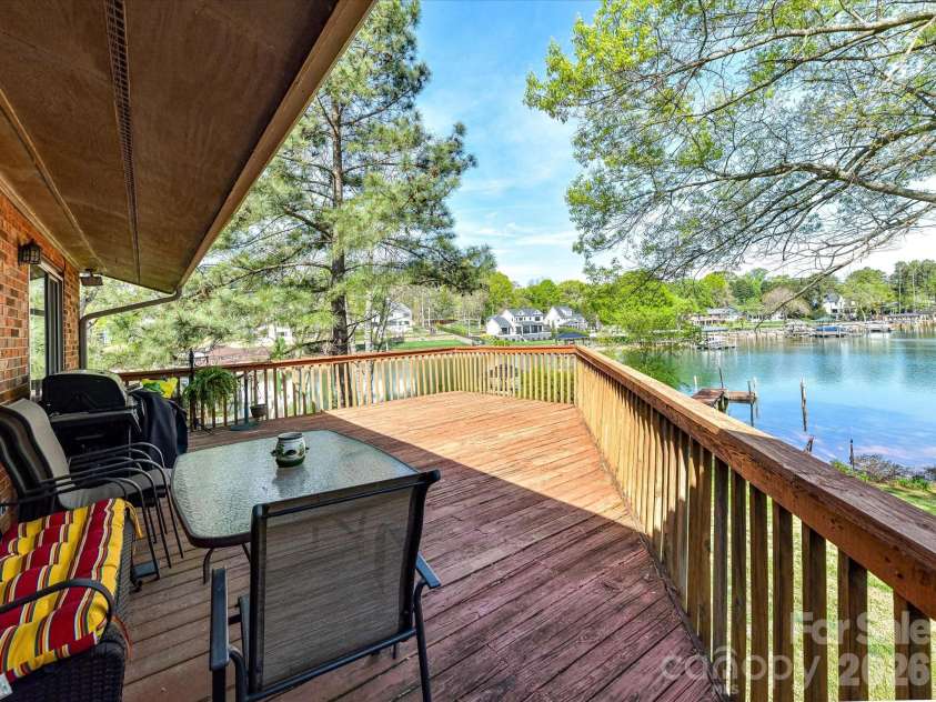 20337 Norman Colony Road, Cornelius, NC 28031.  MLS# CAR4374187, YatesRealty ID 25179. Expansive back deck overlooking Lake Norman, offering the perfect setting for relaxing, entertaining, and enjoying stunning water views.