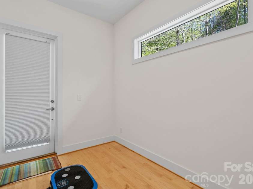 404 Amanda Drive, Mars Hill, NC 28754.  MLS# CAR4374158, YatesRealty ID 25181. Flex space just off the TV Room with a private entrance. Perfect of an office or excercise room.