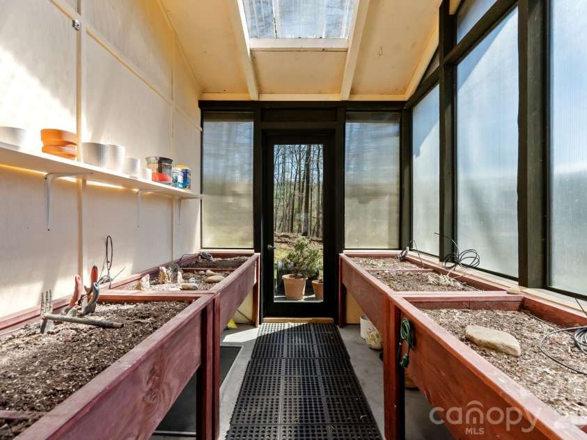 404 Amanda Drive, Mars Hill, NC 28754.  MLS# CAR4374158, YatesRealty ID 25181. Greenhouse off laundry room