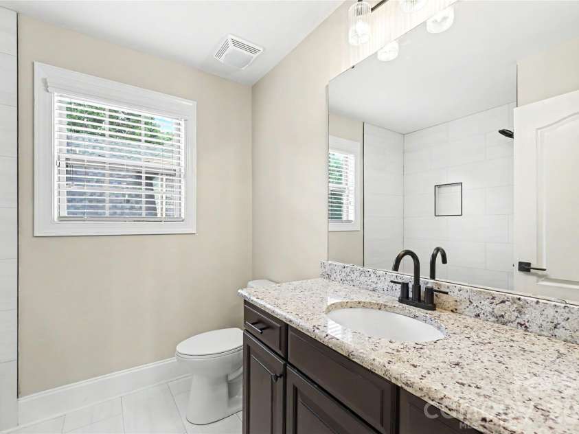 4624 Pebble Run Drive, Matthews, NC 28105.  MLS# CAR4383386, YatesRealty ID 25185. Hall Bathroom