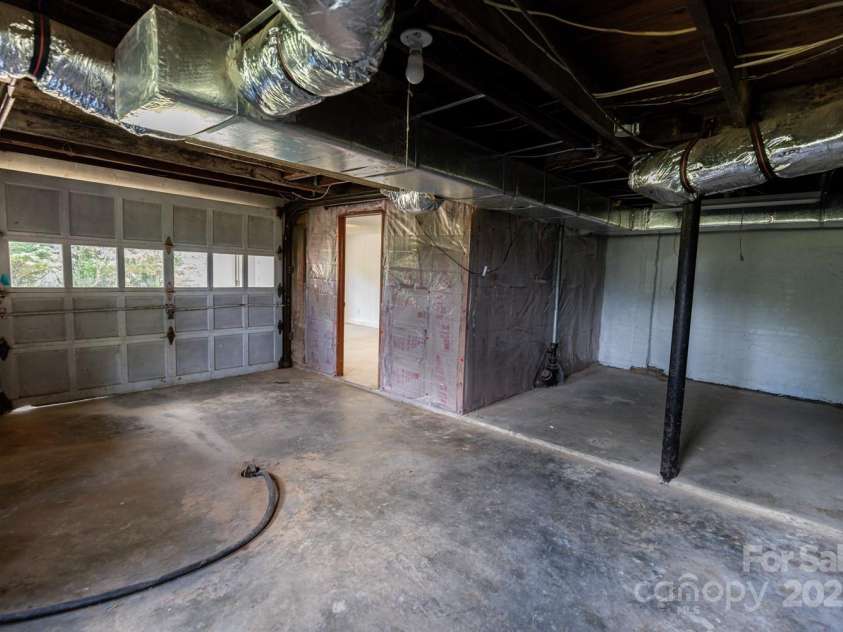 438 Hazel Mill Road, Asheville, NC 28806.  MLS# CAR4269858, YatesRealty ID 25189. Bonus Room with Garage Door, Laundry, Bonus Room - Unfinished Lower