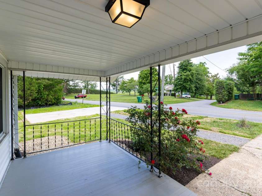 438 Hazel Mill Road, Asheville, NC 28806.  MLS# CAR4269858, YatesRealty ID 25189. Porch looking to new concrete parking pad