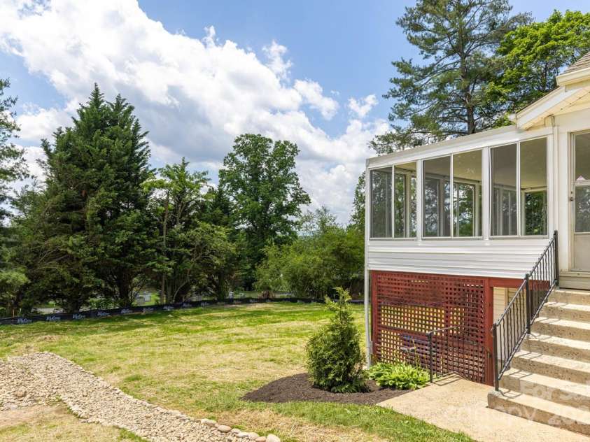 438 Hazel Mill Road, Asheville, NC 28806.  MLS# CAR4269858, YatesRealty ID 25189. Steps down to lower level / covered patio