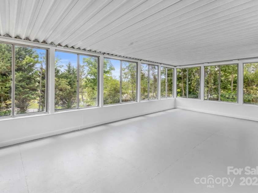 438 Hazel Mill Road, Asheville, NC 28806.  MLS# CAR4269858, YatesRealty ID 25189. Sunroom - Windows on 3 sides